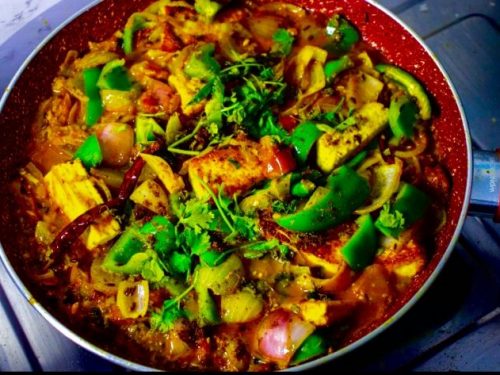 Dhaba Style Paneer Do Pyaza kept in a pan