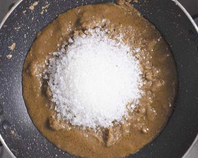 Sugar being added to halwa