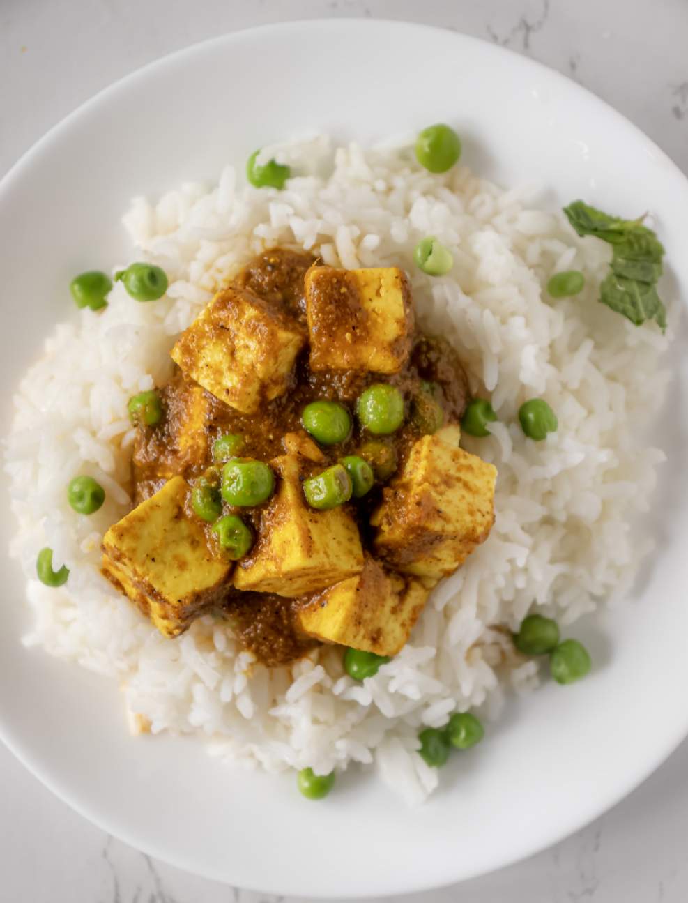 Matar Paneer over a bowl of rice