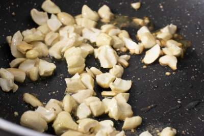 Roasting cashew nuts in a pan