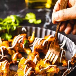 picking out tandoori gobi with fork