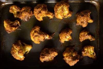 cauliflower florets in baking tray