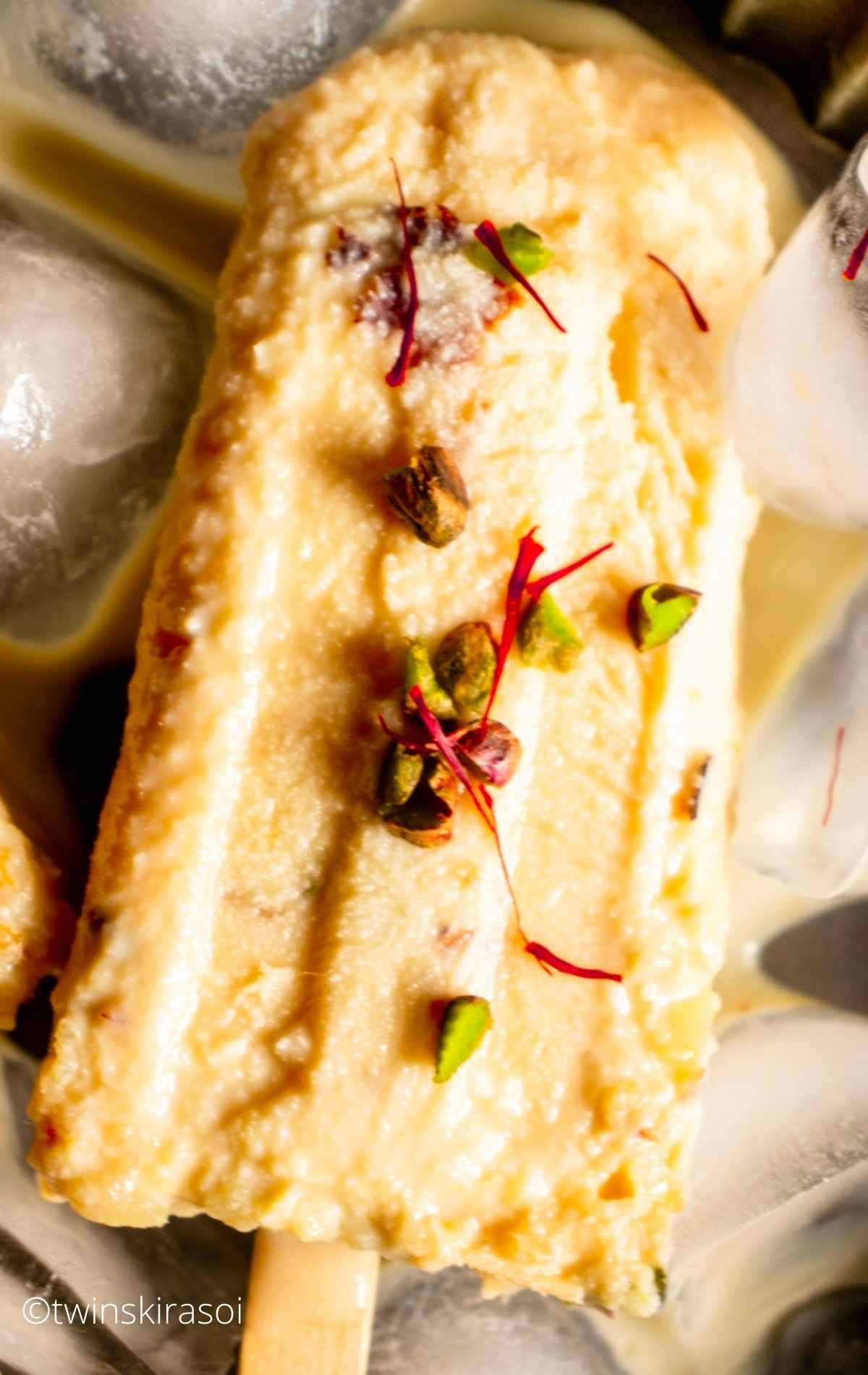 Malai Kulfi Recipe with Kesar Pista on ice cubes