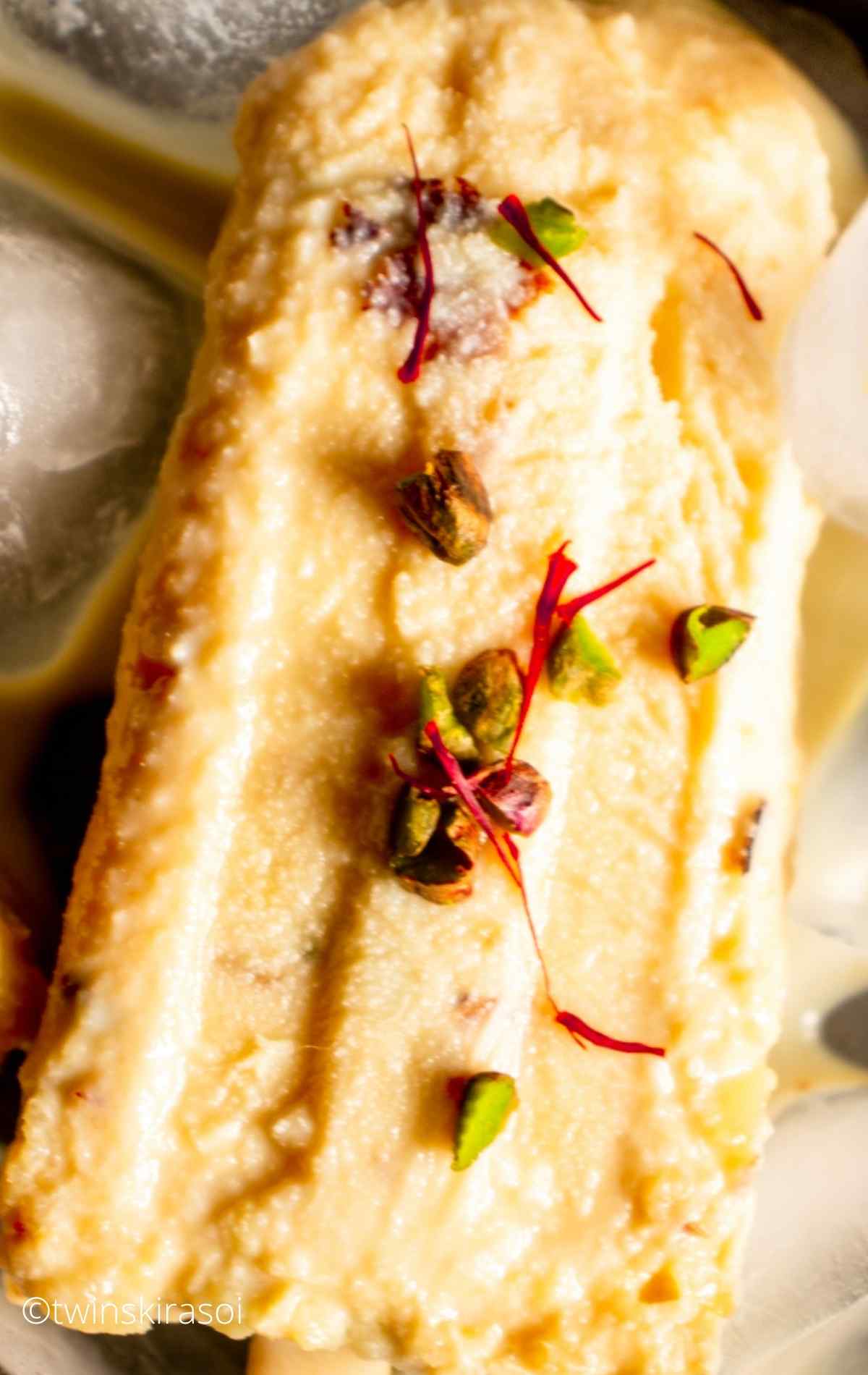 Malai Kulfi Recipe with Kesar Pista on ice cubes